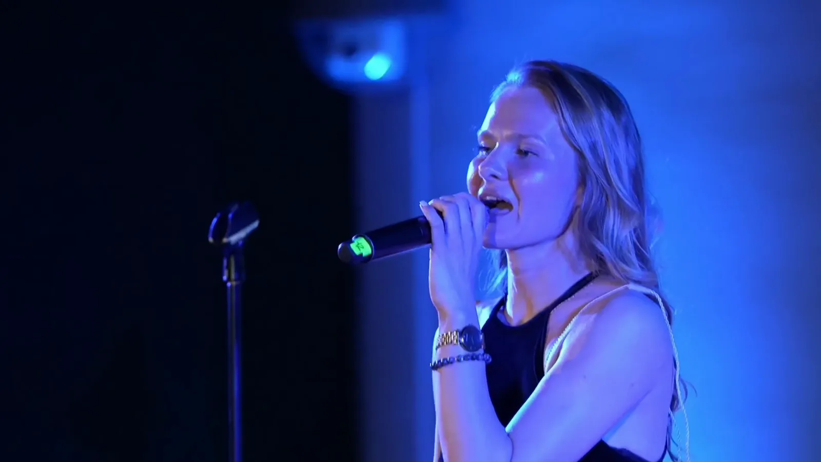 Marina Malina performing live in an event setting