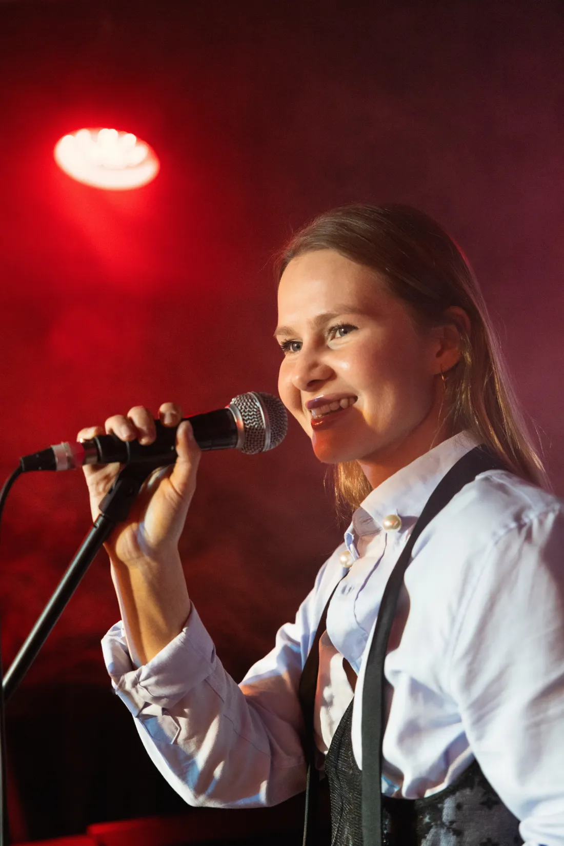 Close view of Marina Malina singing at a live event